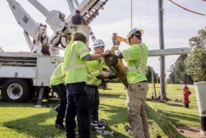 River City Construction lineman installing new equipment
